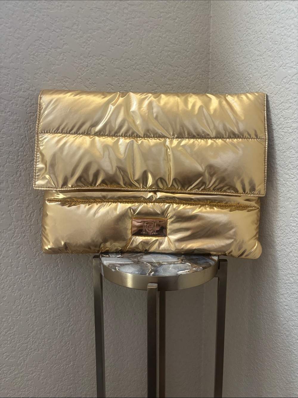Carolina Herrera gold puffer clutch bag